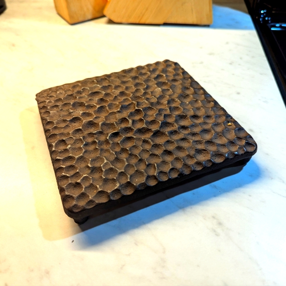 Textured Cast Iron Trivet. 6 Inch Square. 1 Inch High With Legs. Heavy Weight .